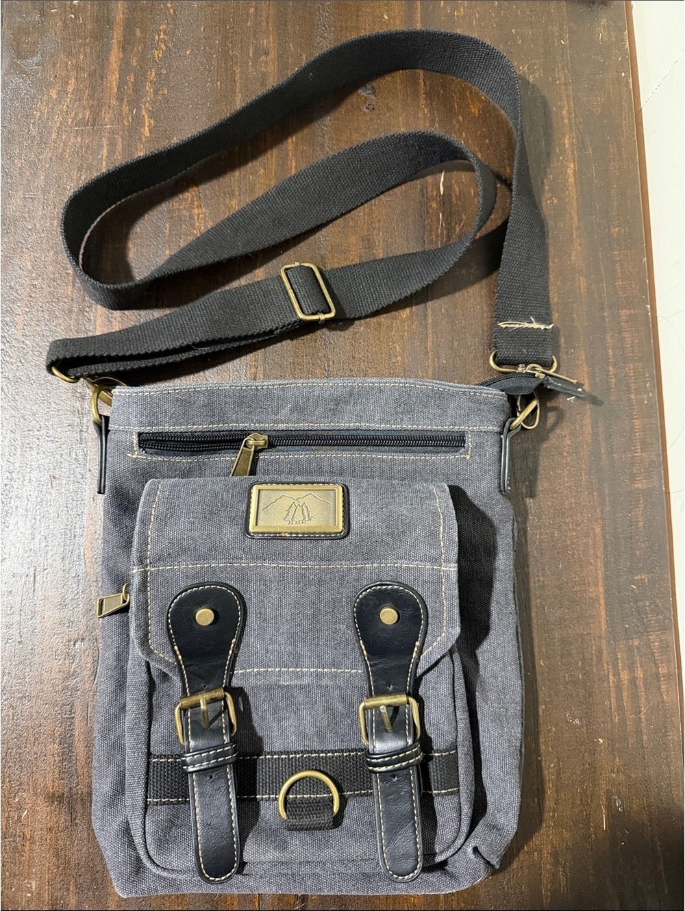 Gray Canvas Crossbody Bag with Adjustable Strap and Buckle Details